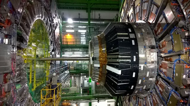 A giant, complex machine inside a laboratory used for physics experiments.